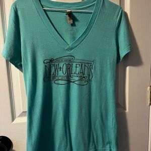 Fleurty Girl New Orleans Graphic V-Neck Women's Top - Teal